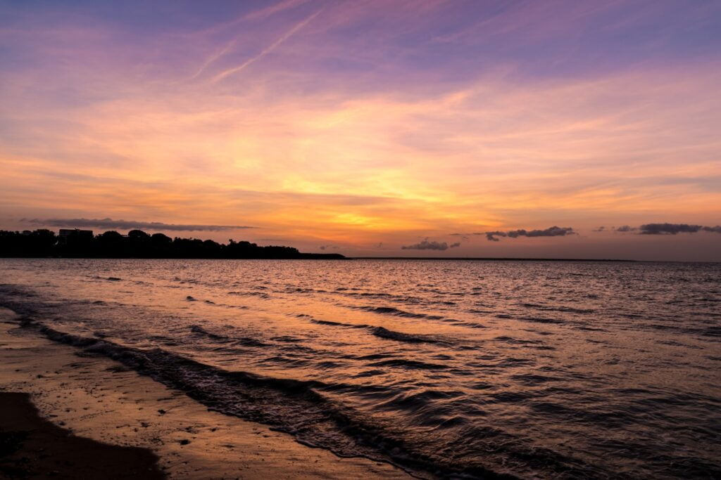 body of water during sunset