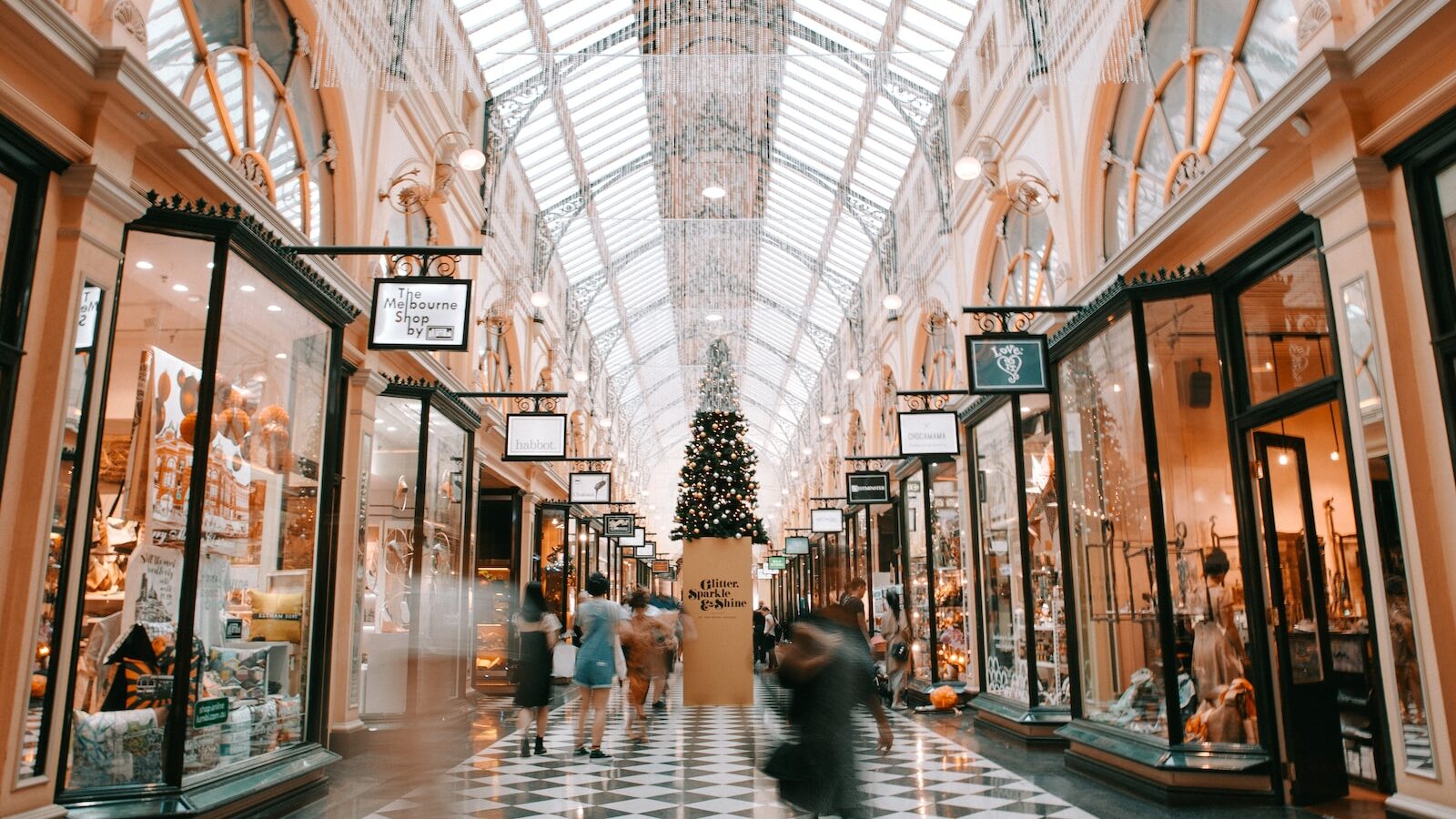 Getting your working holiday visa to australia 1 Person walking inside building near glass - working holiday visa - backpacker visa - working in australia