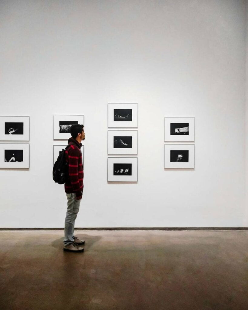 The best Art Galleries & Museums for Backpackers in Melbourne 8 backpacker Standing Beside White Painted Wall