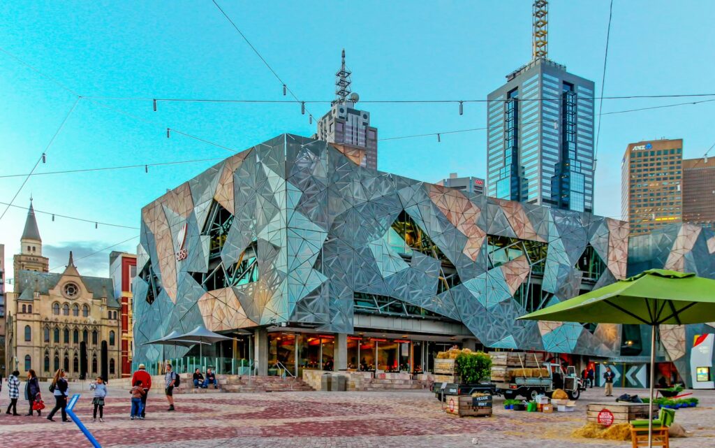 The best Art Galleries & Museums for Backpackers in Melbourne 5 Australian Centre for the Moving Image (ACMI) building with a lot of backpackers walking around it
